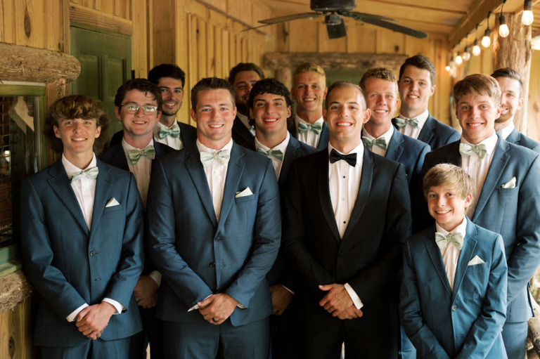 groomsmen standing on Cabin porch