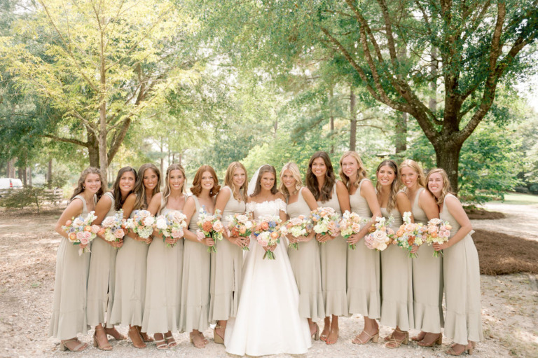 bridal party standing under oak tree