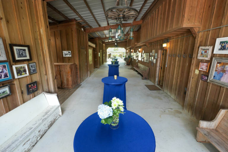 Breezeway set with bistro tables, clothes and flowers